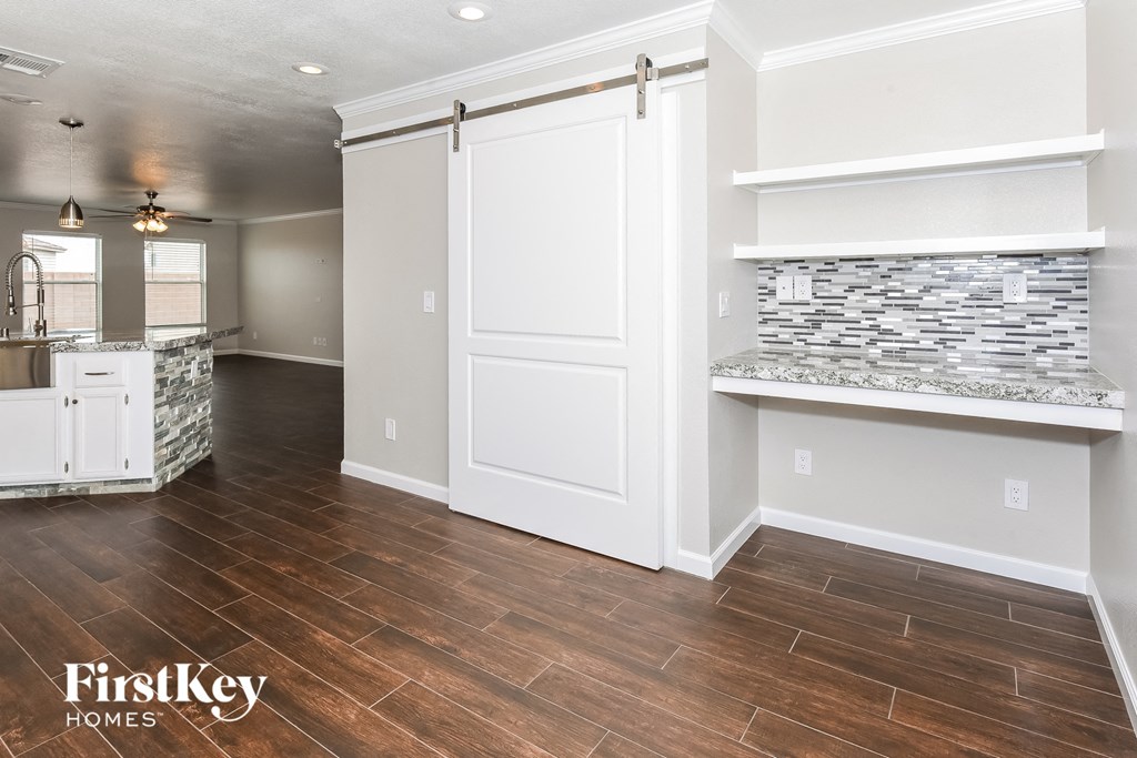 the kitchen and living room of a new home