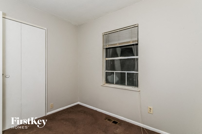 a small room with a window and a door