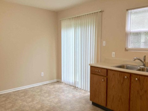 A kitchen with a sink and cabinets.