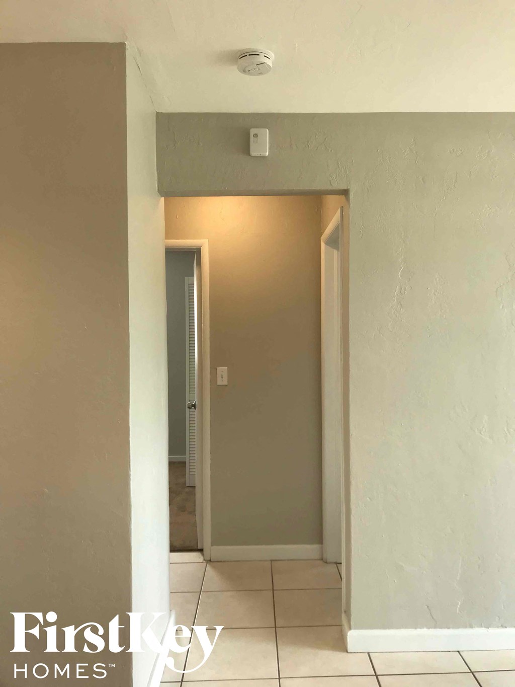 a view of the hallway from the living room through to the dining room and kitchen
