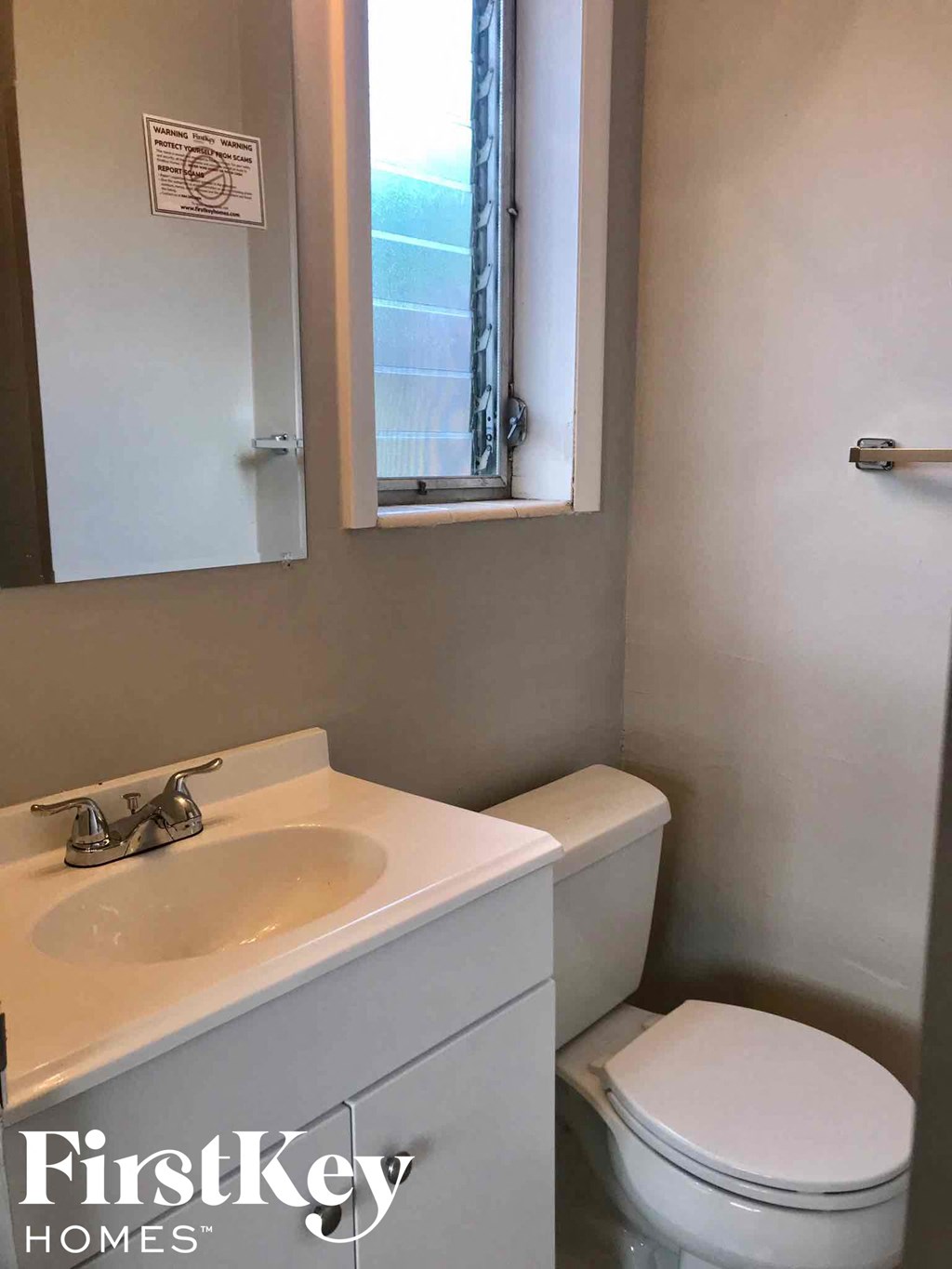 a small bathroom with a toilet and a sink
