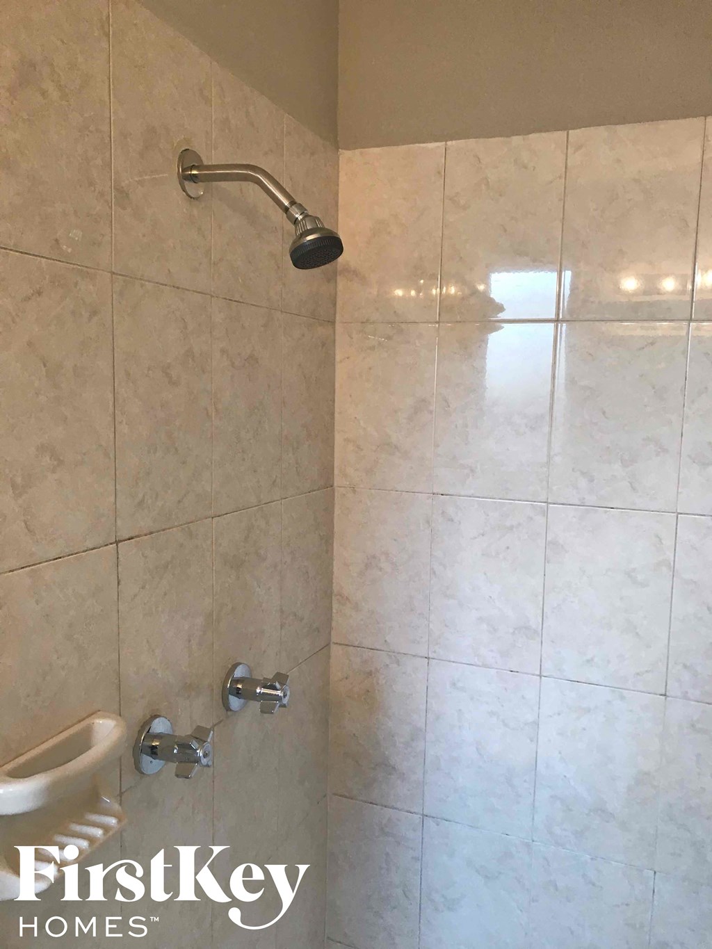 a bathroom with a shower and a toilet in it
