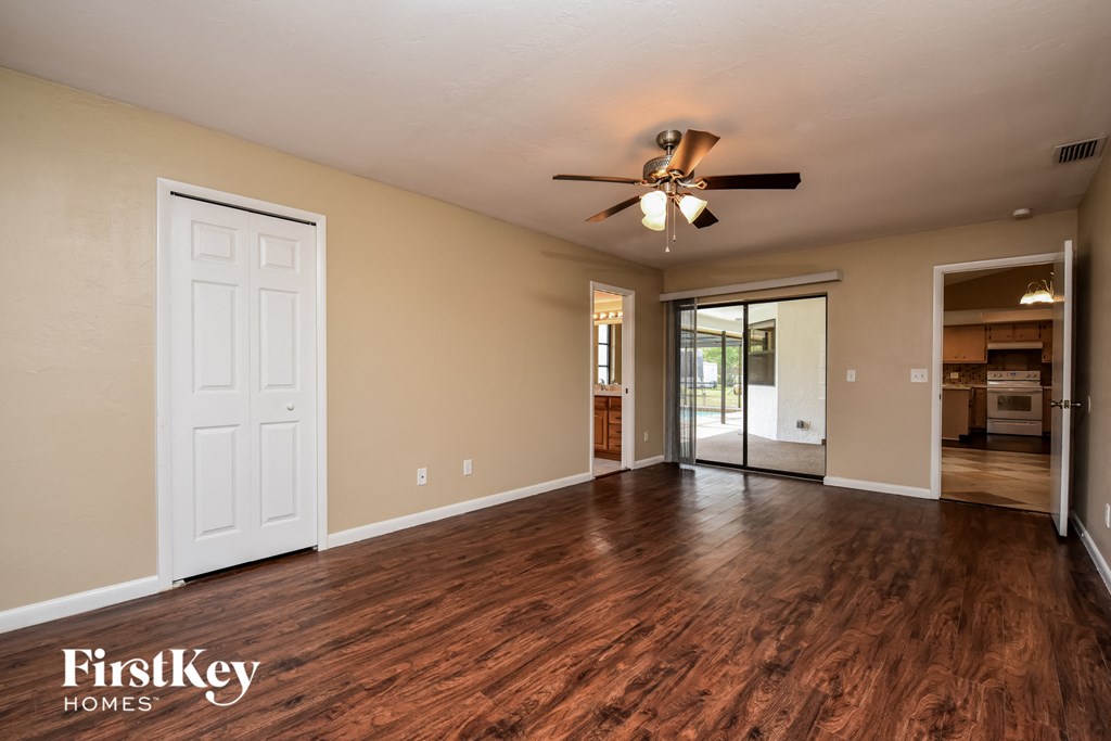 the living room is open to the dining room and kitchen