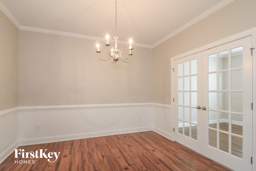 the dining room doors and a chandelier