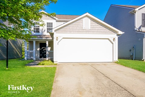 A house with a garage is for sale by FirstKey Homes.