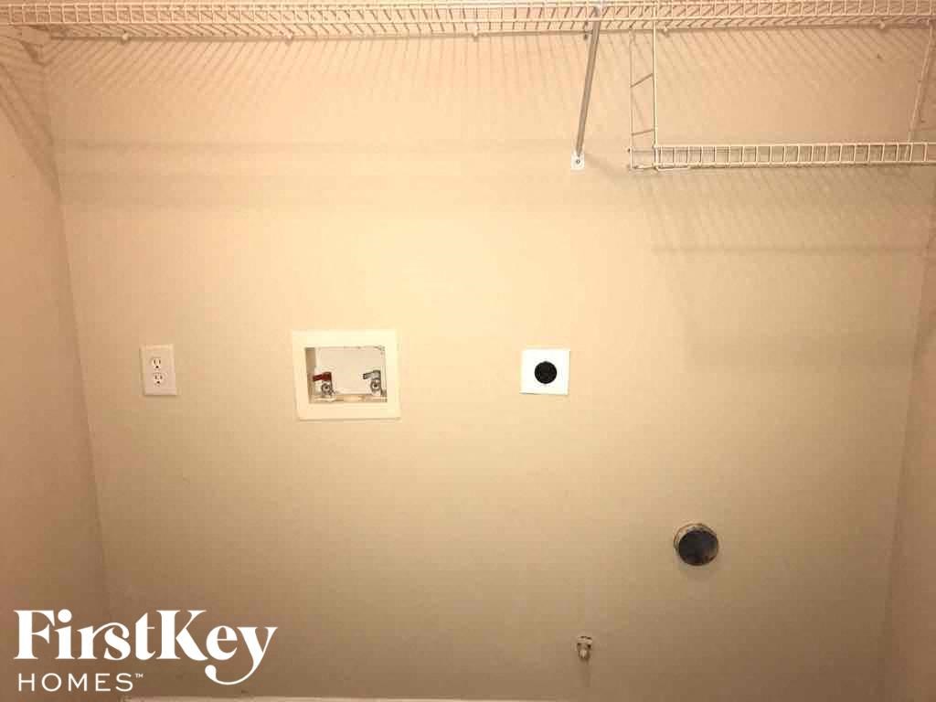 two pictures on a wall in a bathroom with a shower