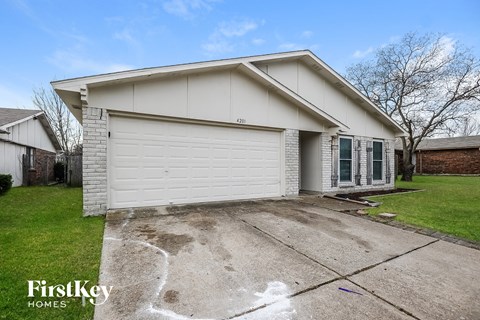 A house with a garage is for sale by FirstKey Homes.