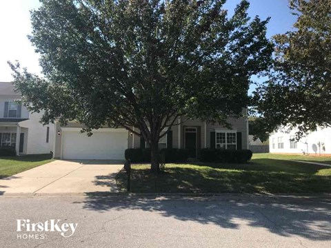 a house with a tree in front of it