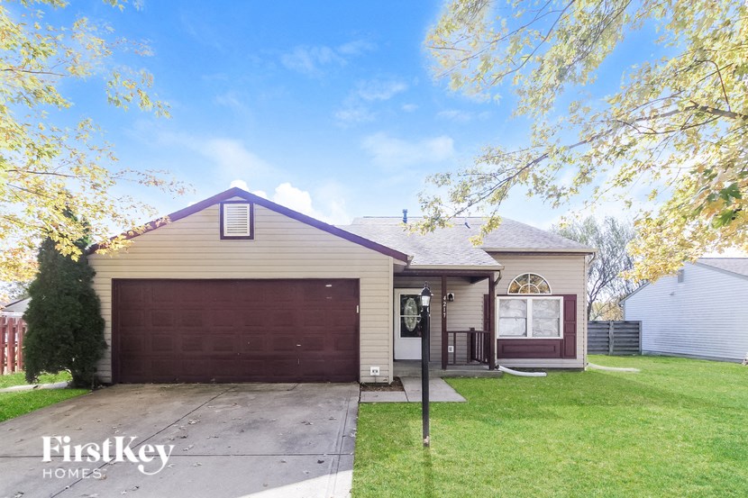 a home with a driveway and a garage door