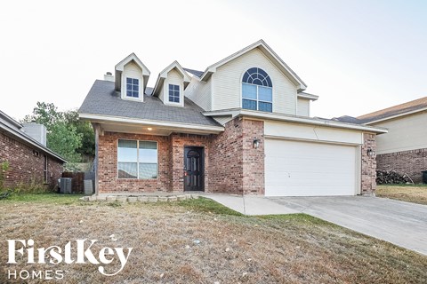 a house with a driveway and a garage door