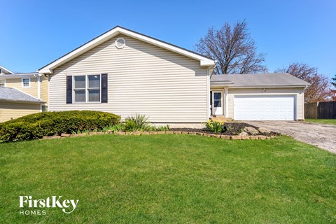 a home with a lawn and a driveway