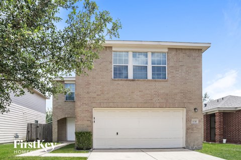 a brick house with a white garage door