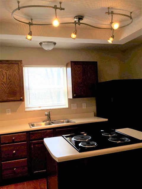 a kitchen with a stove and a sink