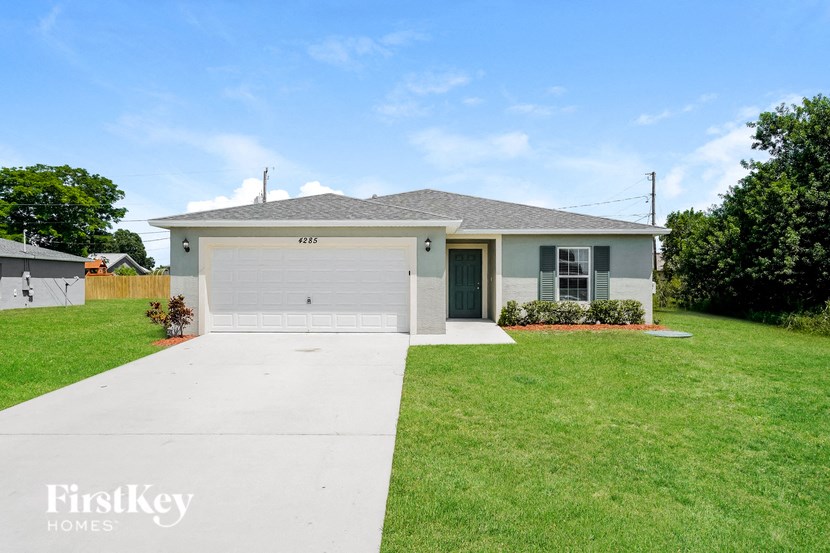 A house with a garage is for sale by FirstKey Homes.