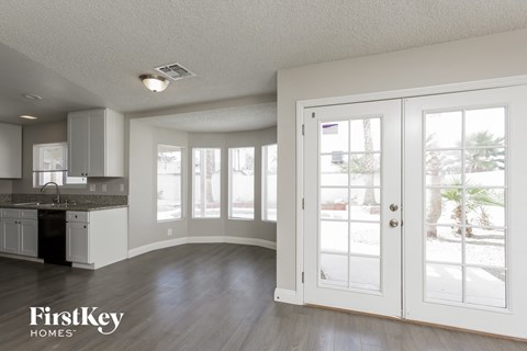 A kitchen with a sink and a window.