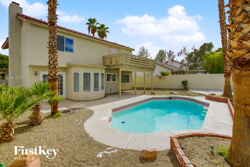 A house with a pool in the backyard.