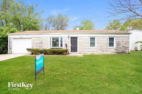 A house with a flag in front of it.