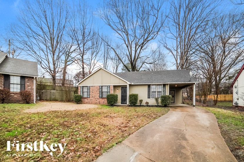 A house with a driveway in front of it.