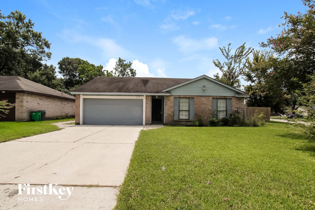 A house with a garage is for sale by FirstKey Homes.