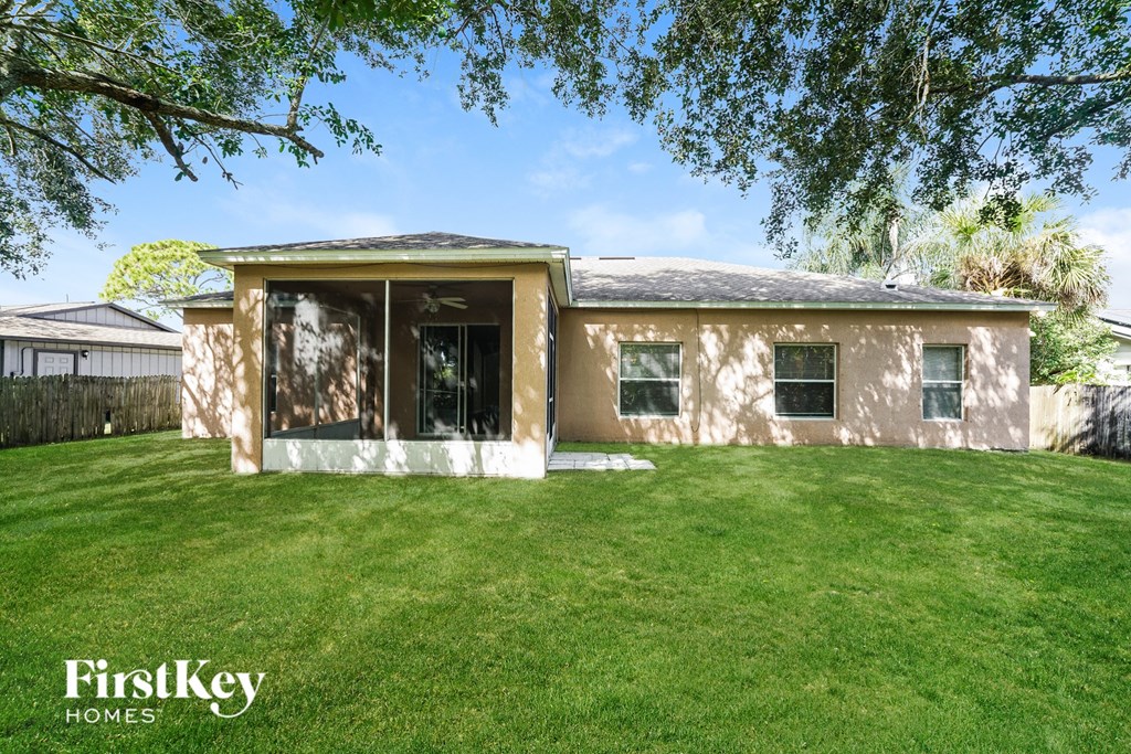 A house with a lawn in front of it.