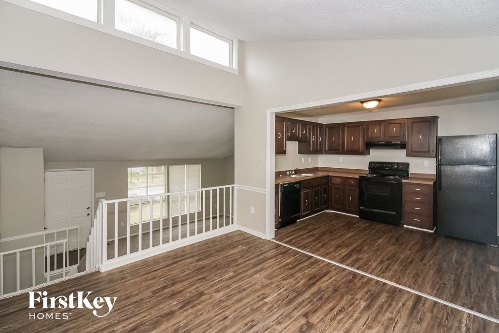 the kitchen and living room of an open floor plan