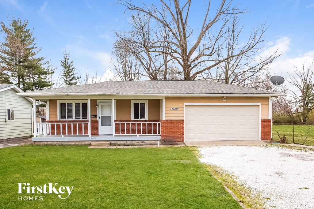 A house with a garage is for sale by FirstKey Homes.