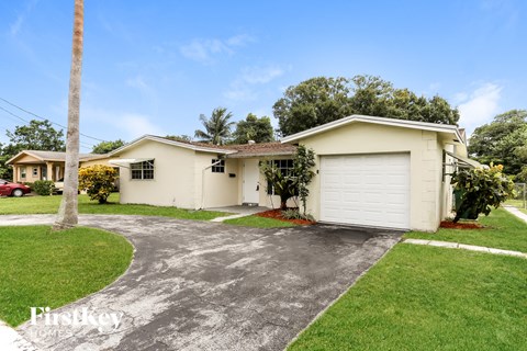 A house with a white garage door and a driveway.