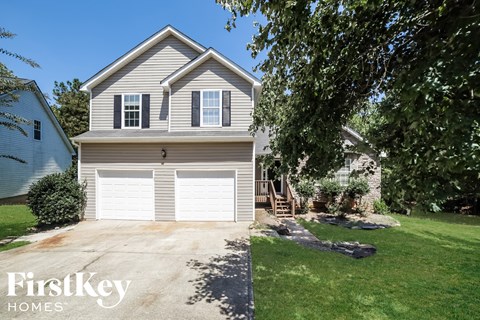 a white garage door in front of a house