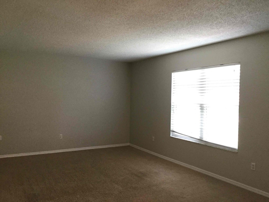 an empty room with a large window