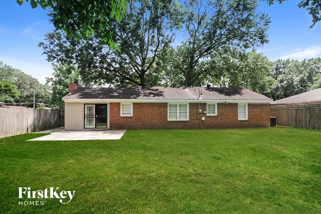 A house with a lawn in front of it.