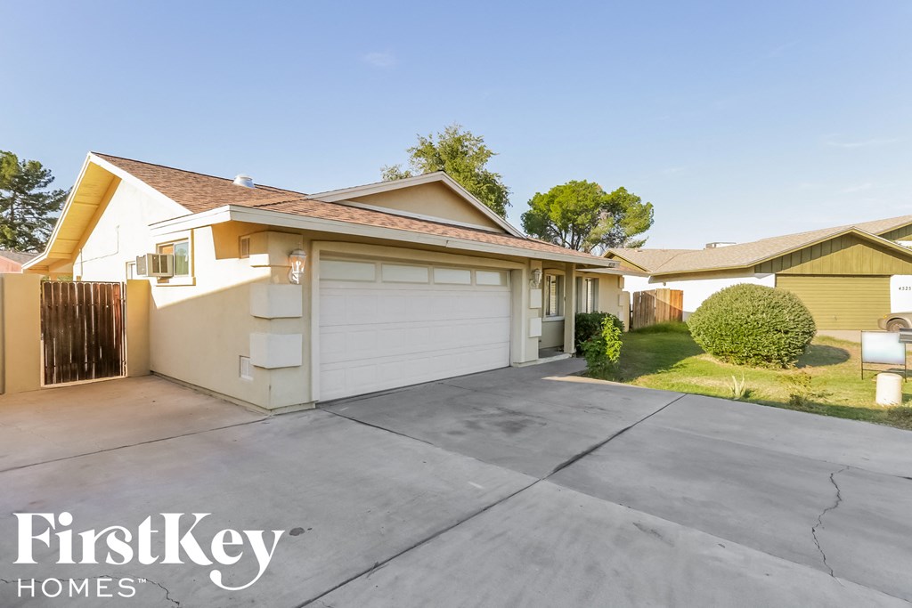 a home with a driveway and a garage door