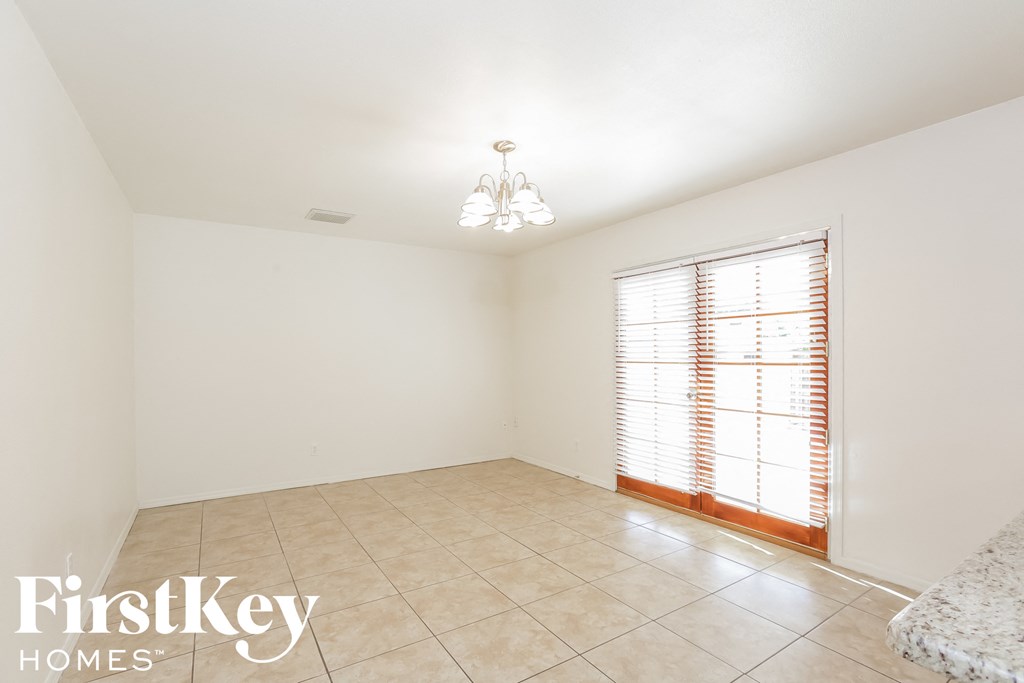 the living room is clean and ready to be used as a dining room
