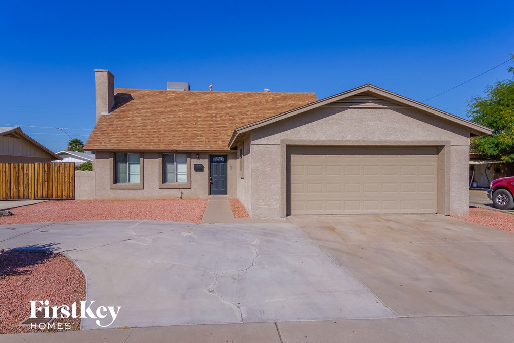 a home with a driveway and a garage door