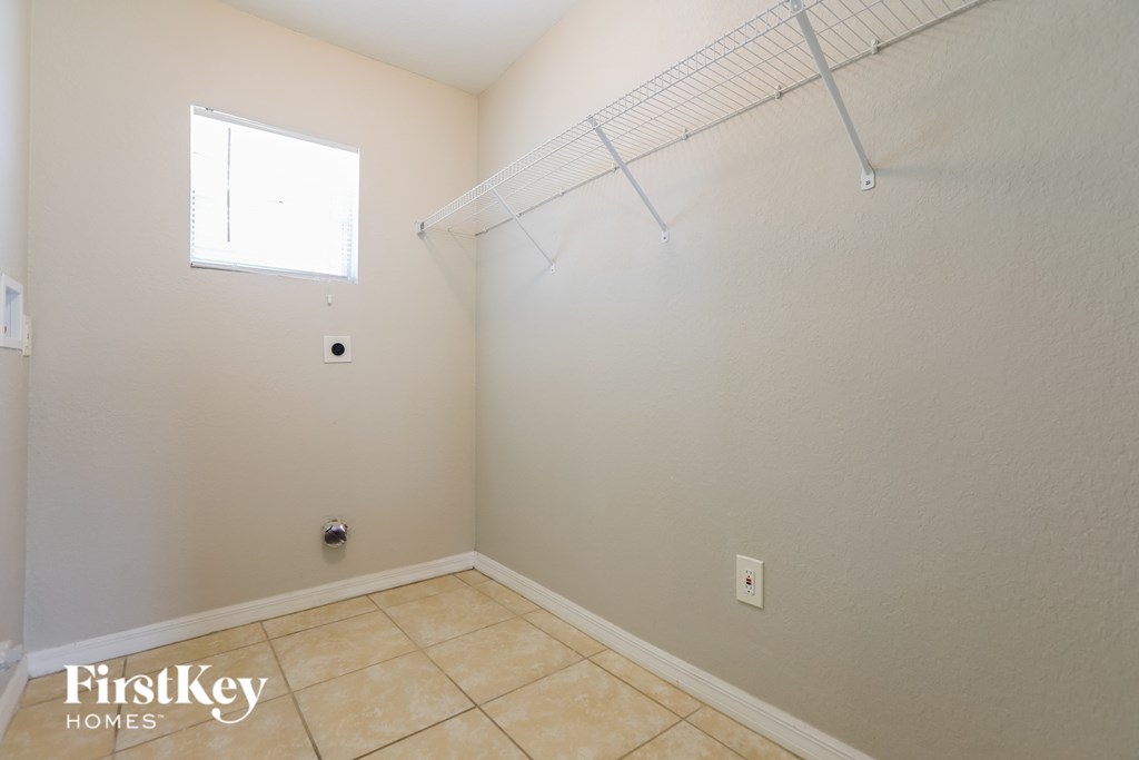 A room with a FirstKey Homes logo on the bottom left.