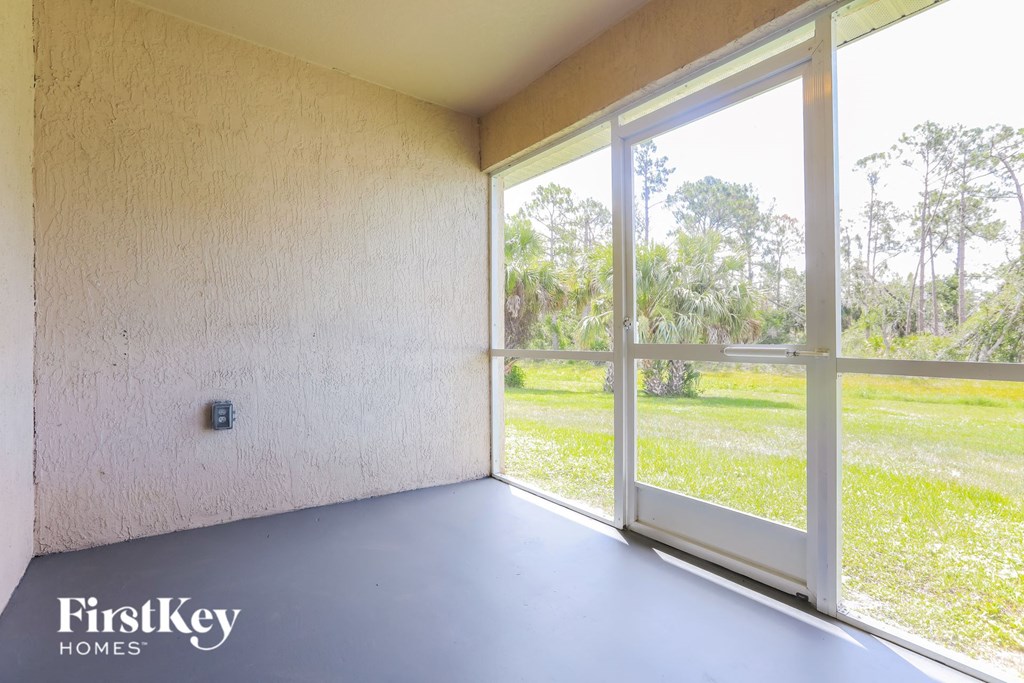 A room with a FirstKey Homes logo on the bottom left corner.