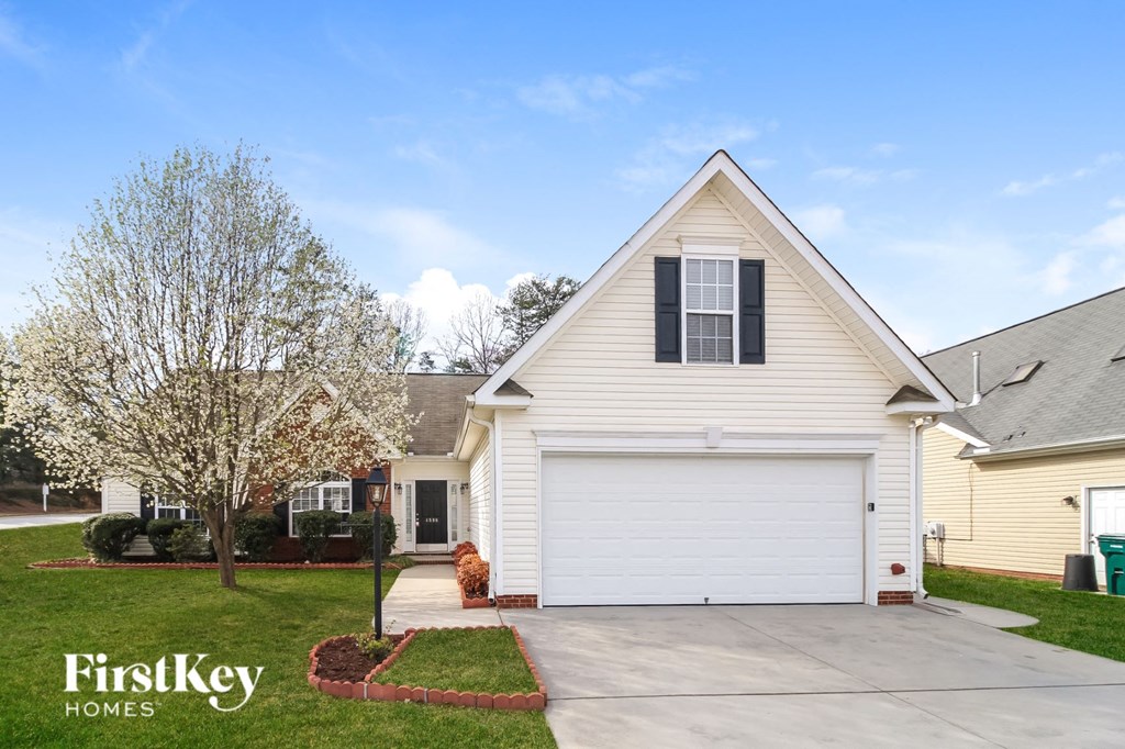 a white house with a white garage door