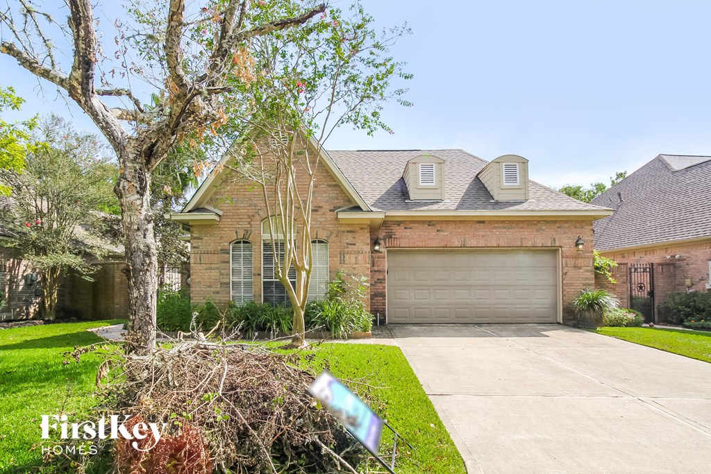 a house with a driveway and a garage door