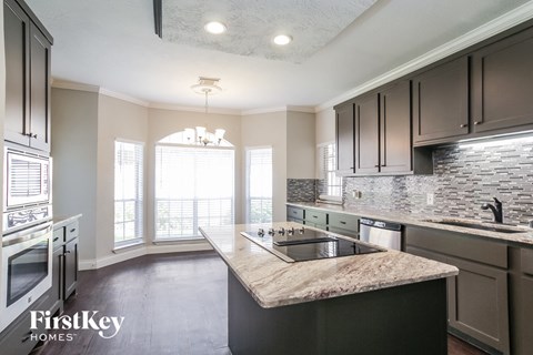 a kitchen with a sink and a counter top