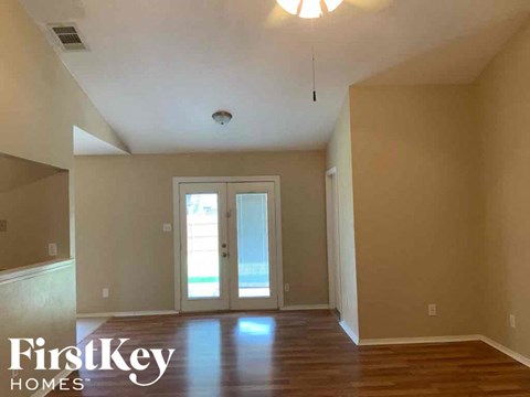 A room with a FirstKey Homes logo on the wall.