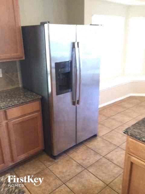 a stainless steel refrigerator in a kitchen