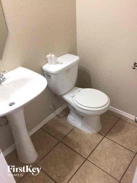 a bathroom with a toilet and a sink