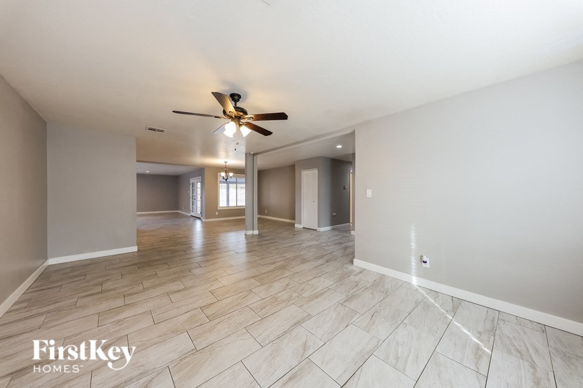 the living room and dining room are spacious and empty
