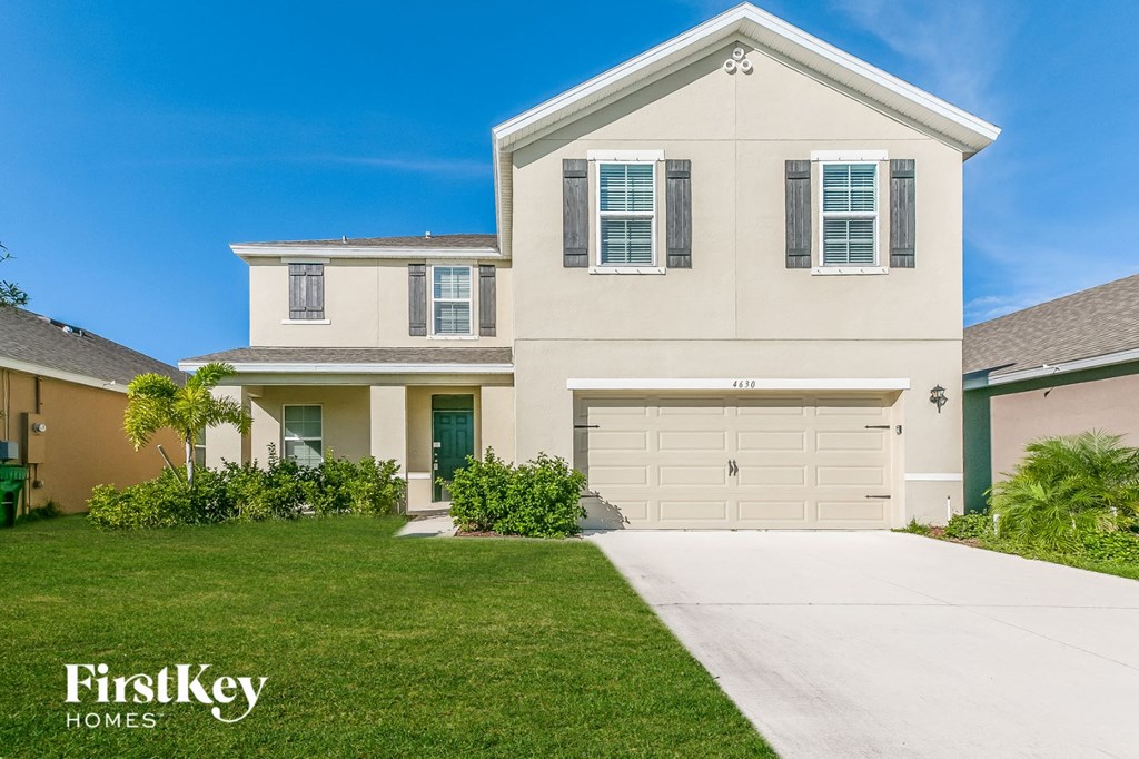 A two-story house with a garage is for sale by FirstKey Homes.