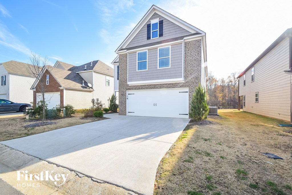 A house with a garage is for sale by FirstKey Homes.
