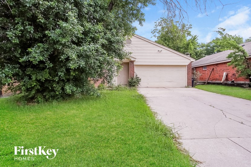 a house with a driveway and a garage door