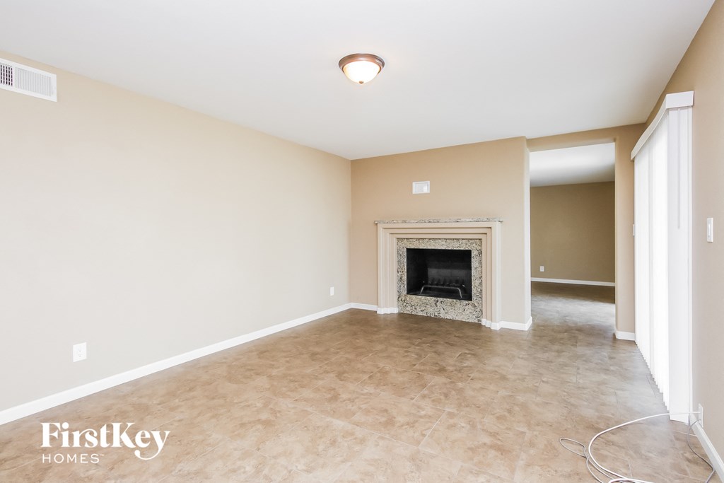 the living room of a home with a fireplace