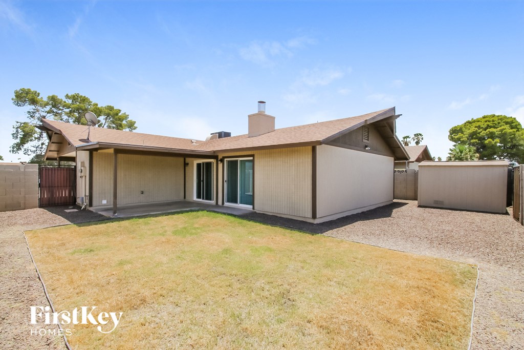 a backyard with a yard and a house