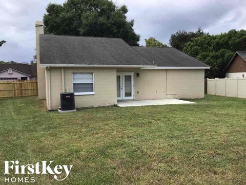 A house with a brown roof and a white door is shown with the words "FirstKey Homes" on the bottom.