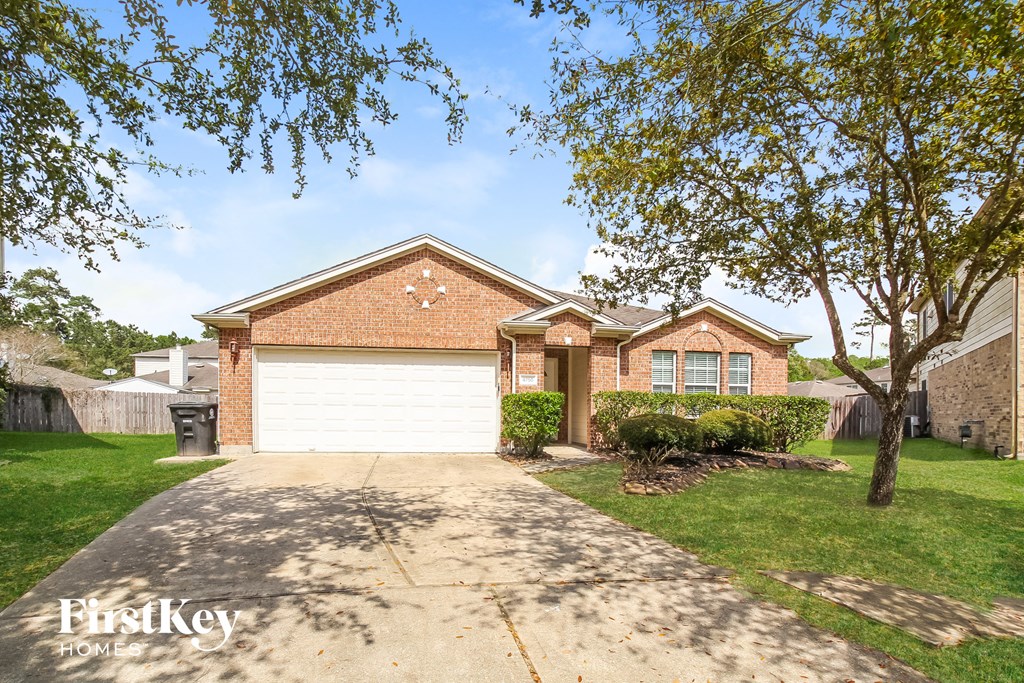 a home with a white garage door and a driveway