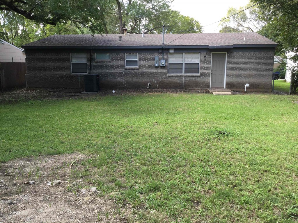 a view of the house from the back yard